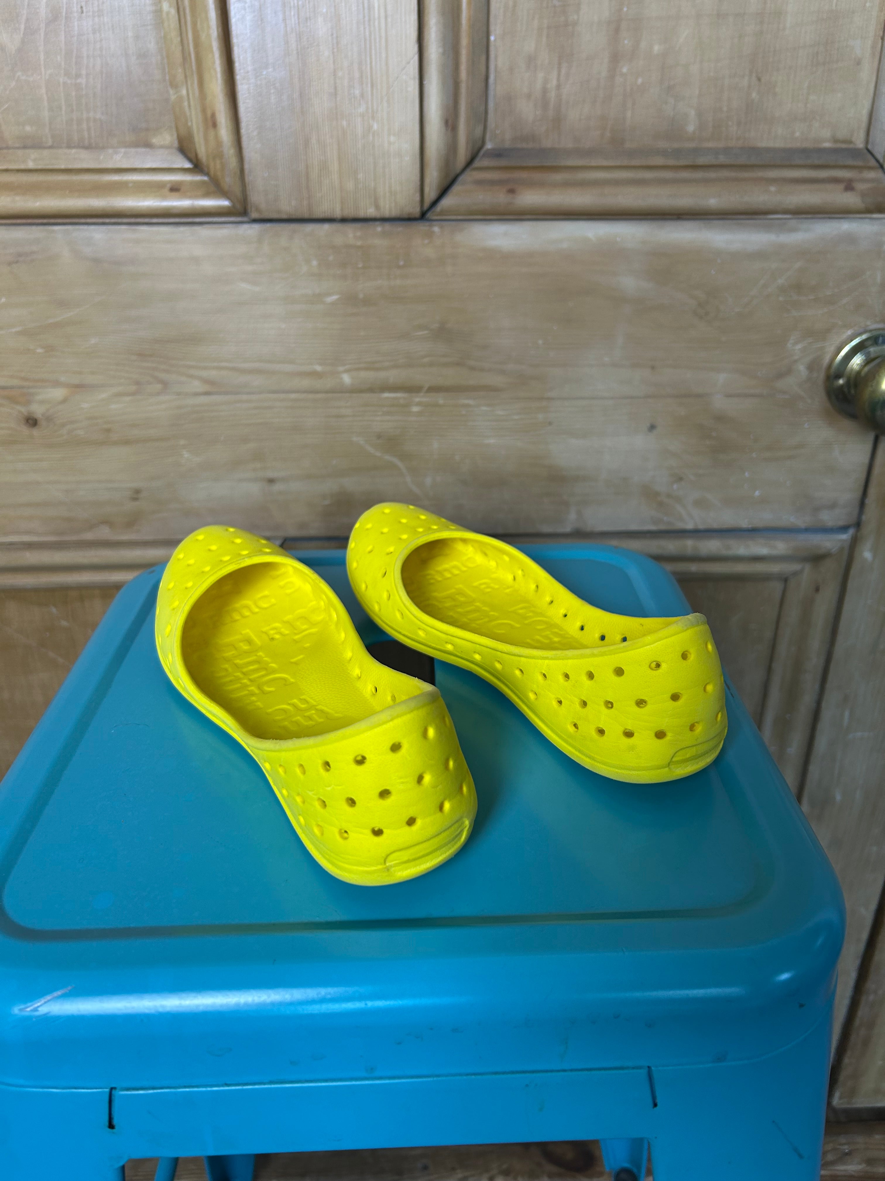 Bright yellow ballet flats