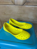 Bright yellow ballet flats