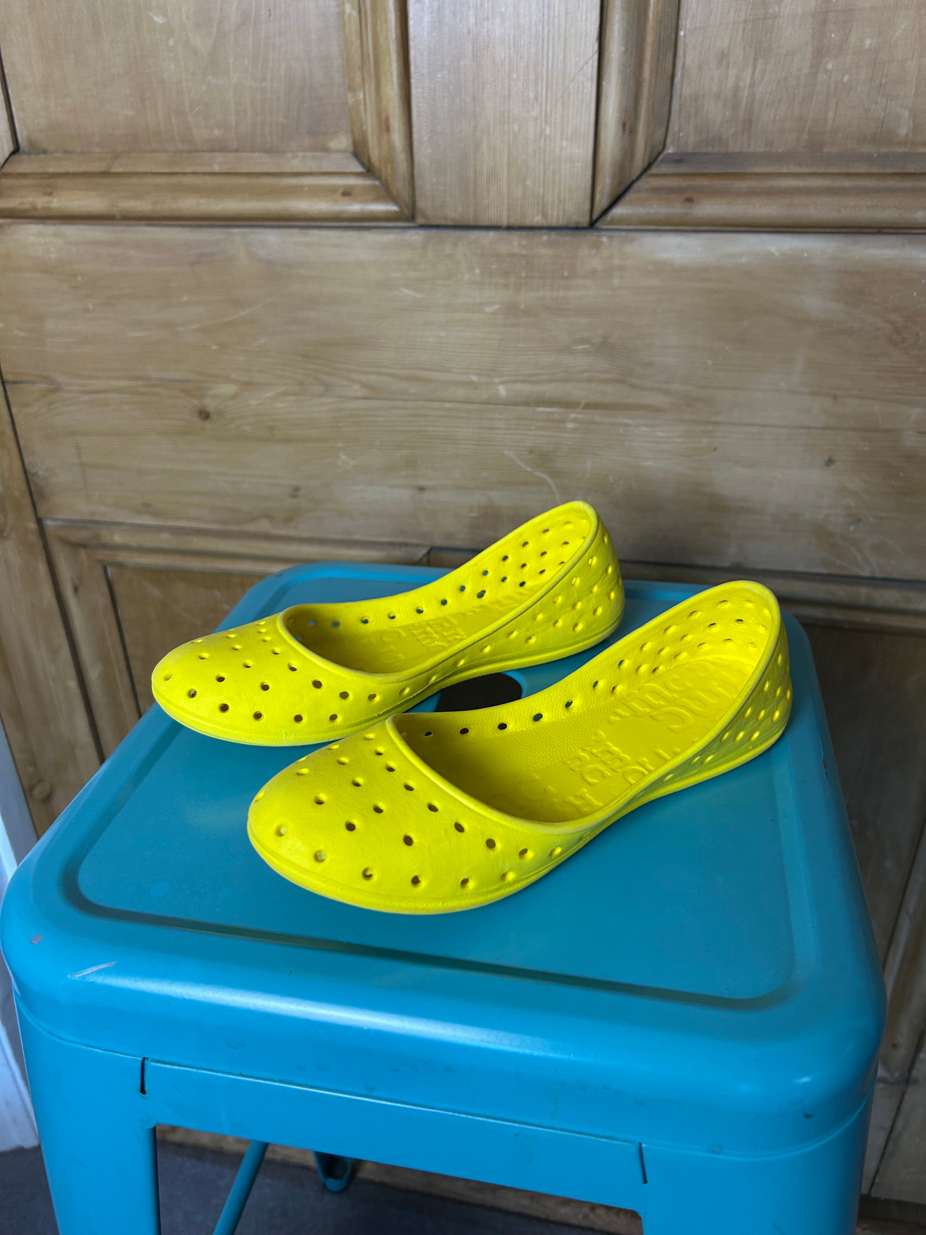 Bright yellow ballet flats