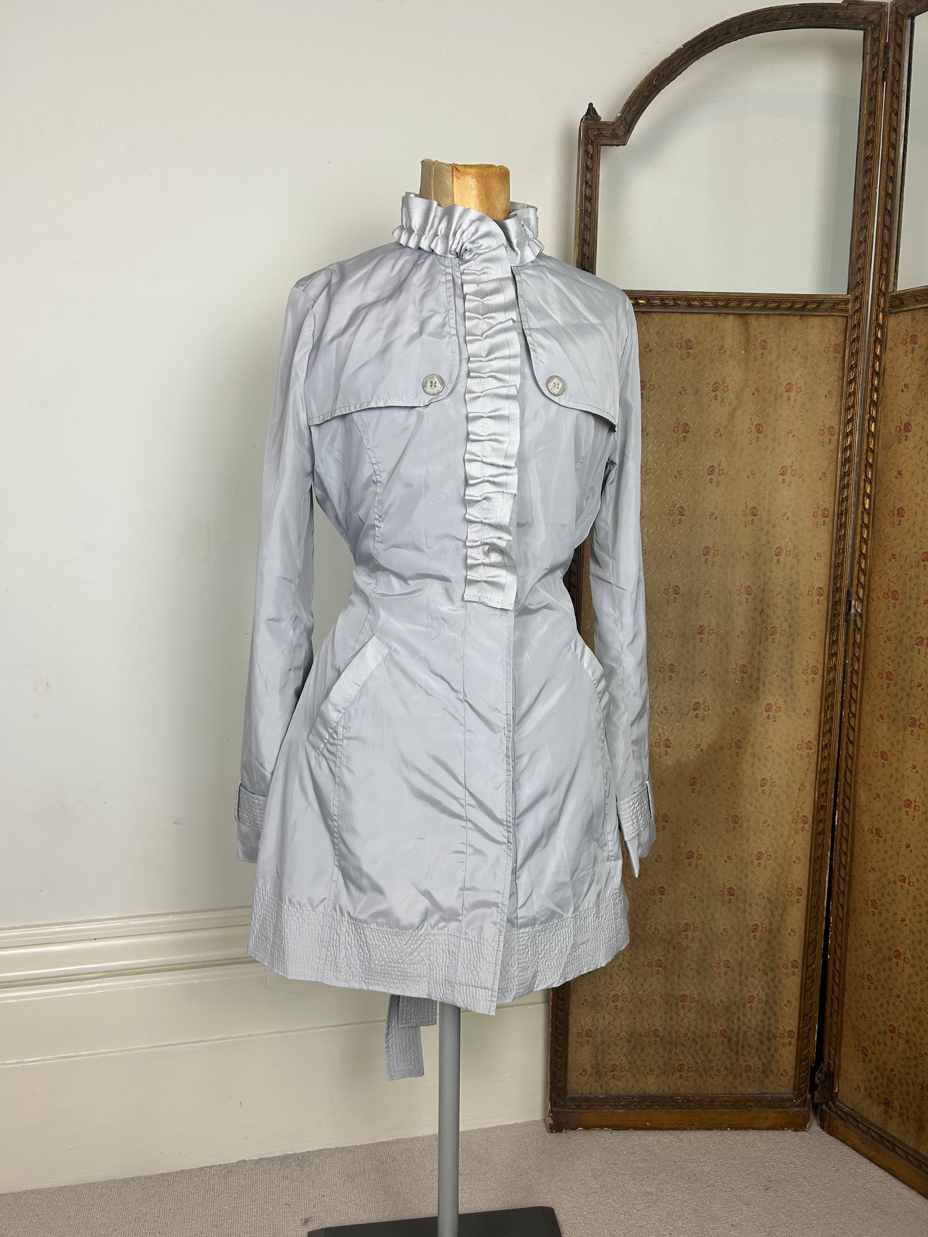 Silver ruffle trench coat
