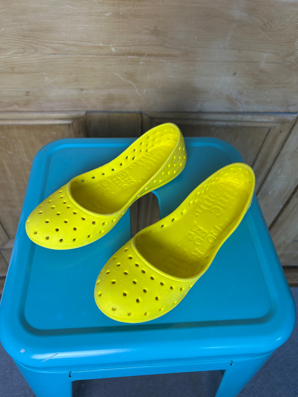 Bright yellow ballet flats