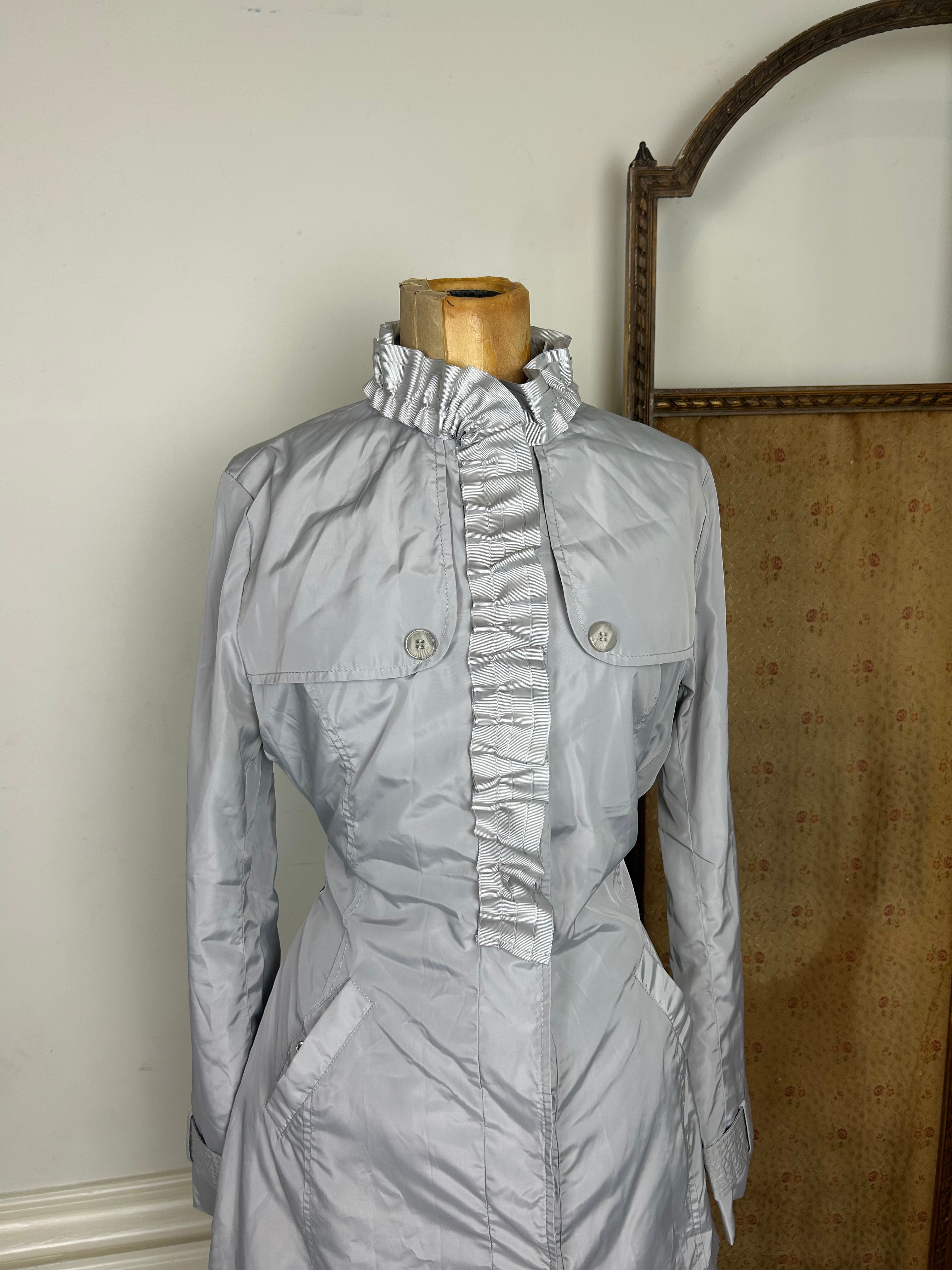 Silver ruffle trench coat