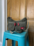 Khaki handbag with red accents