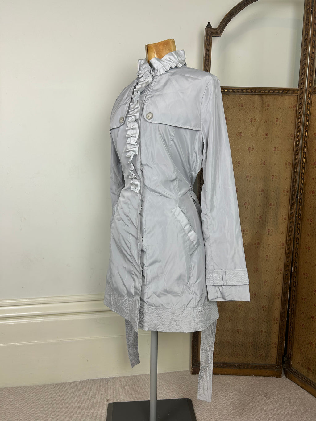 Silver ruffle trench coat