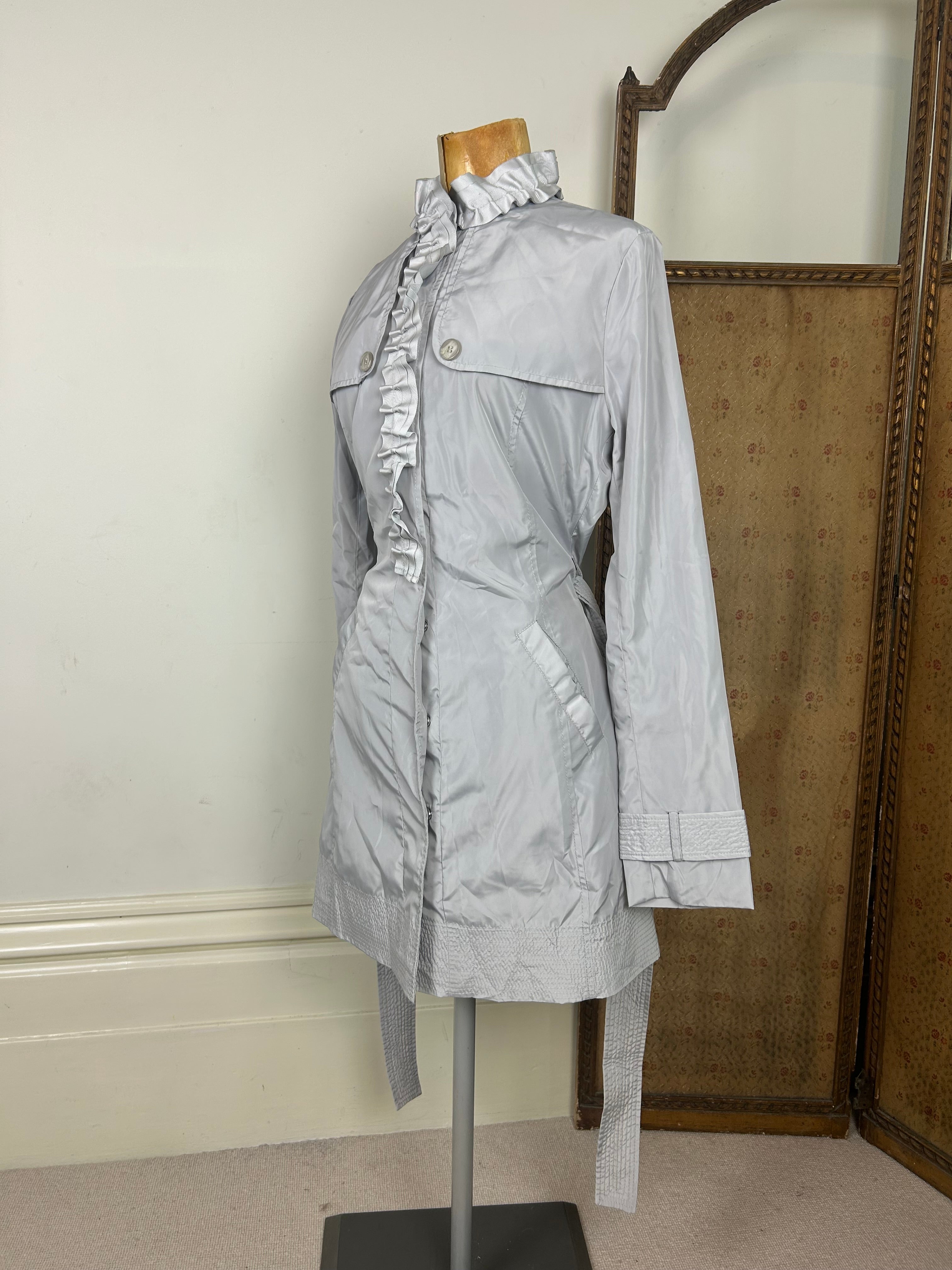Silver ruffle trench coat