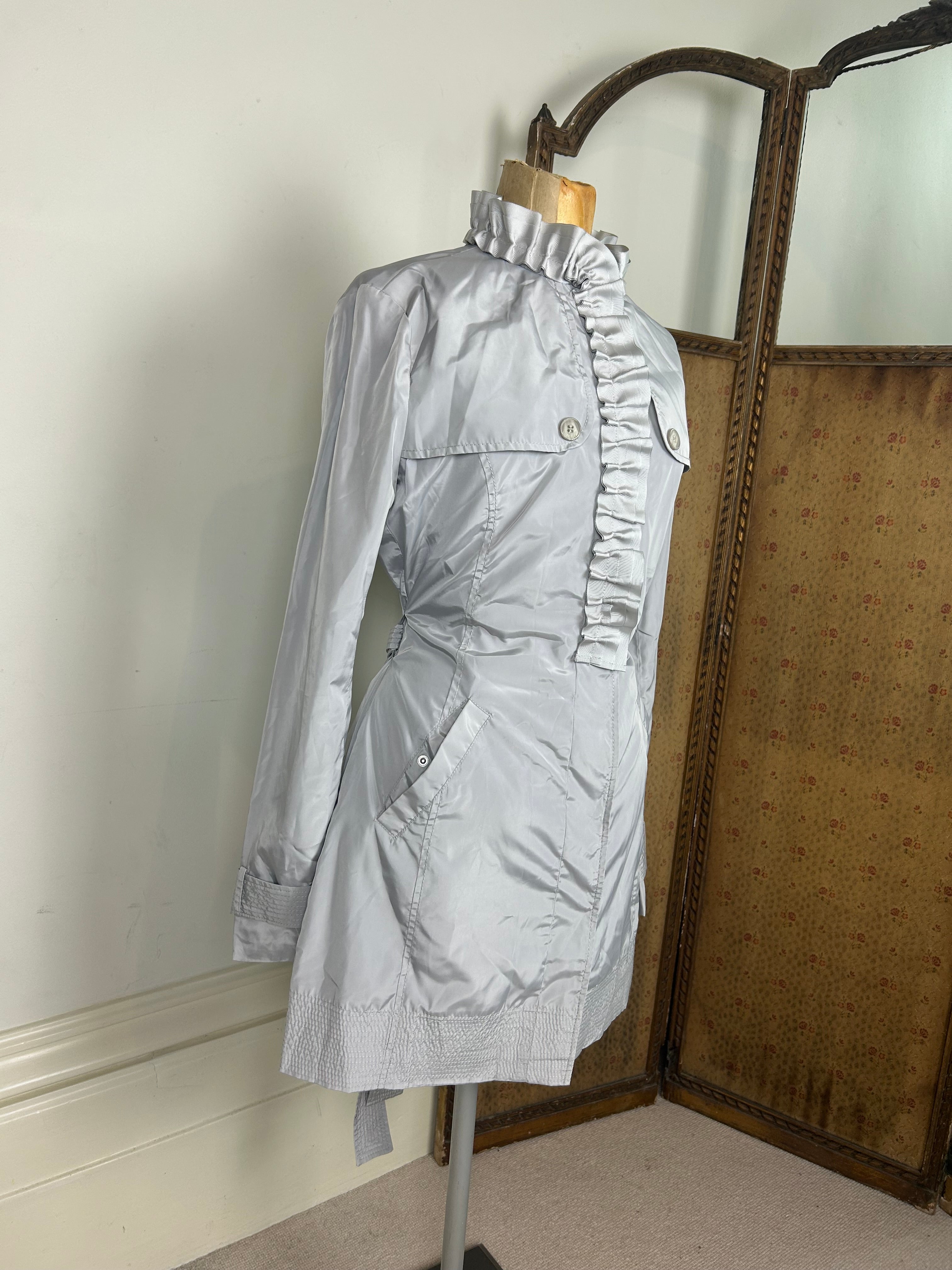 Silver ruffle trench coat