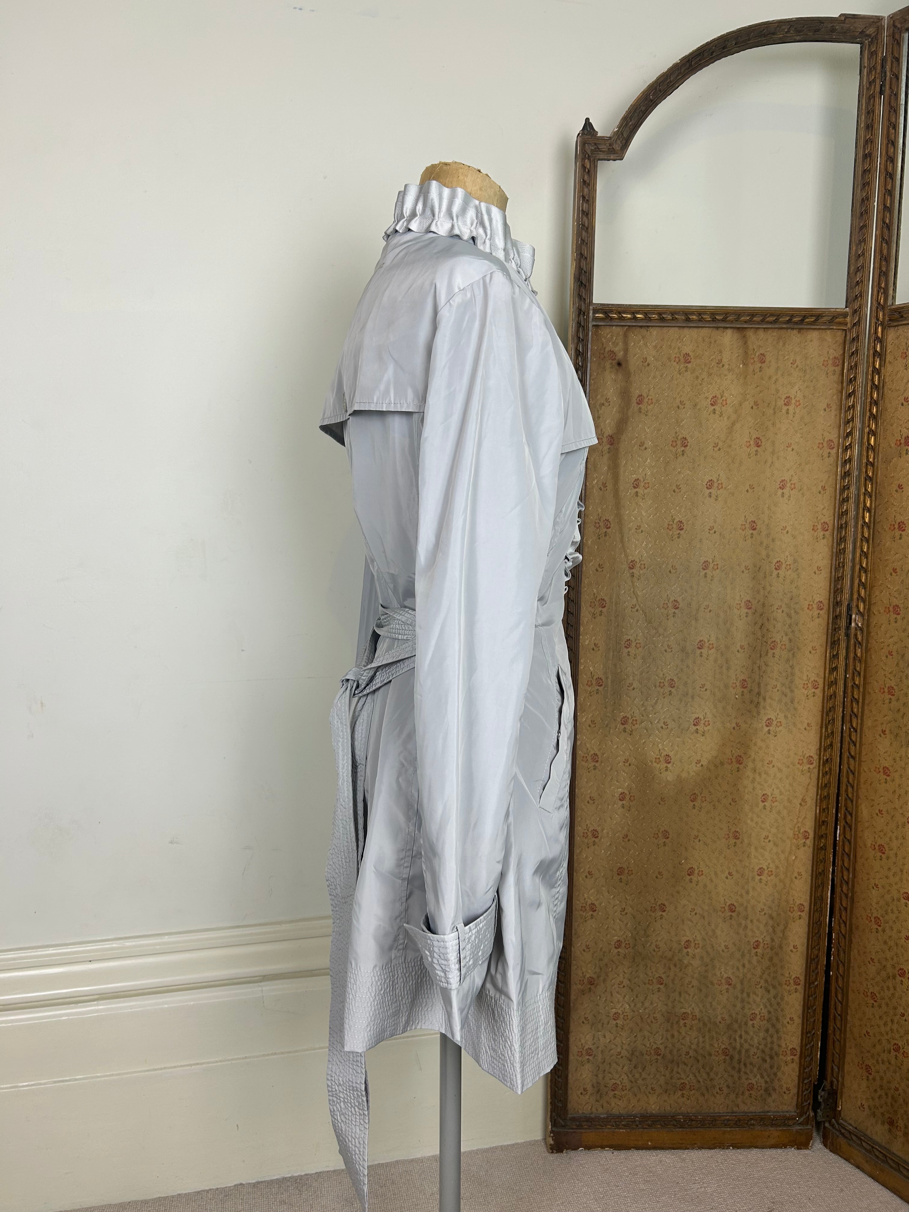 Silver ruffle trench coat